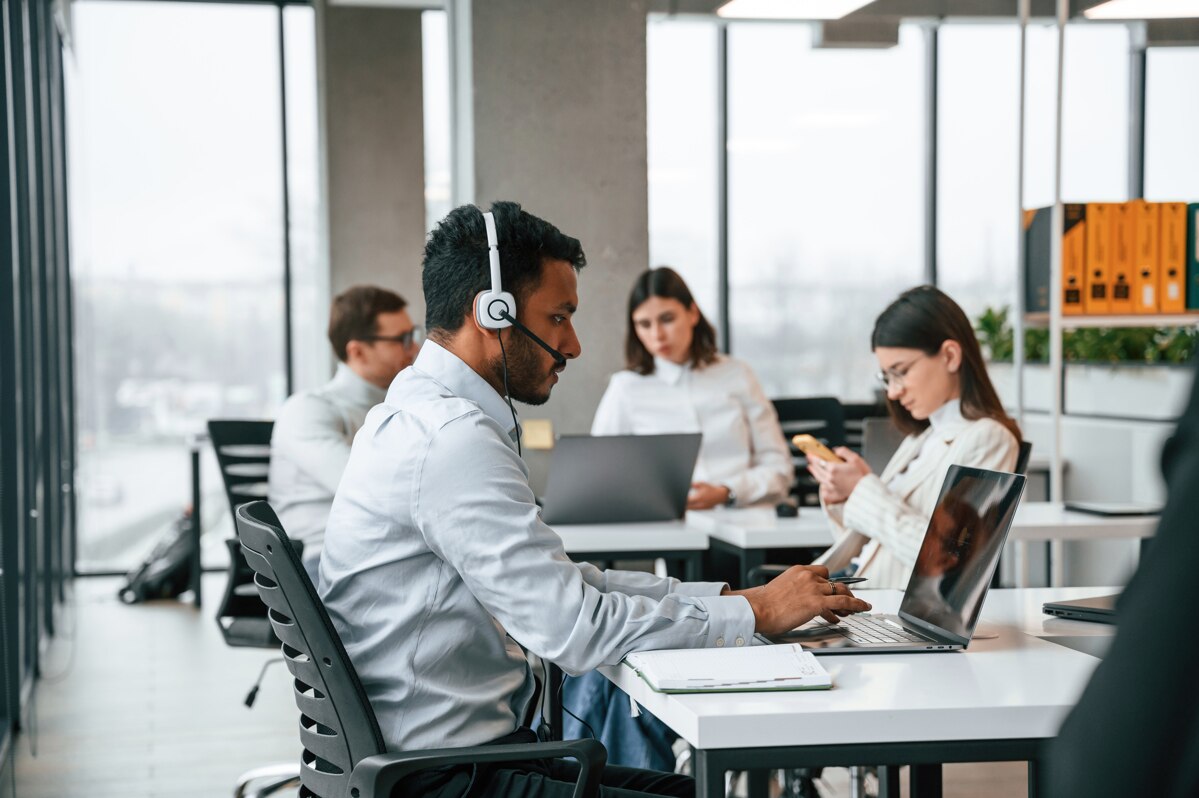 Workers in office using wireless technology
